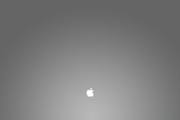 Bardzo małe jabłko Apple na szarym tle