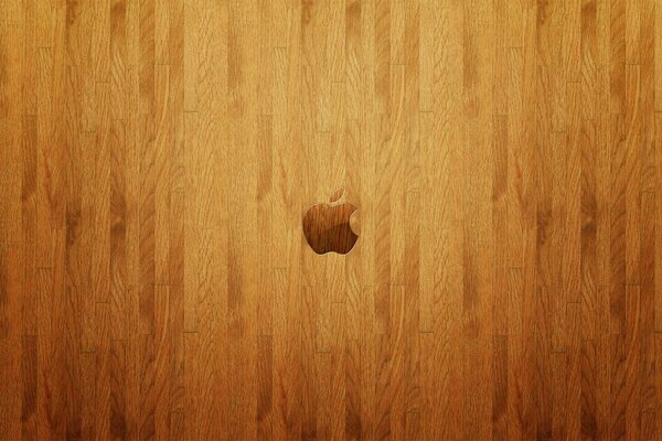 Logo Apple na drewnianej podłodze