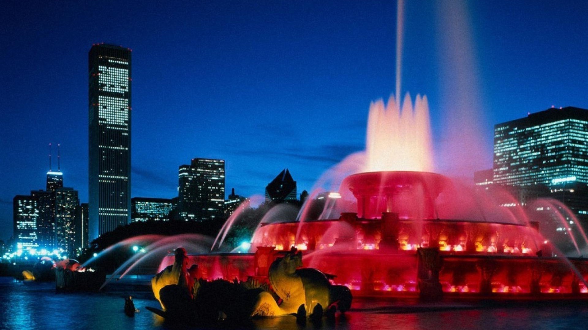 miasto śródmieście wieżowiec miasto wieczorem zmierzch podróże skyline architektura dom miasto światło ulica zachód słońca most woda odbicie podświetlane rzeka niebo