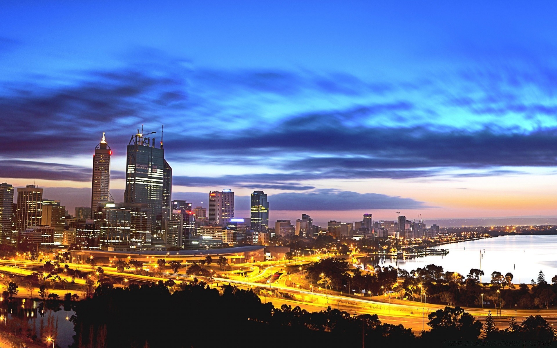 australia i oceania miasto architektura miasto zmierzch skyline zachód słońca podróże wieczór centrum miasta dom niebo wieżowiec woda podświetlany na zewnątrz świt panoramiczny miejski